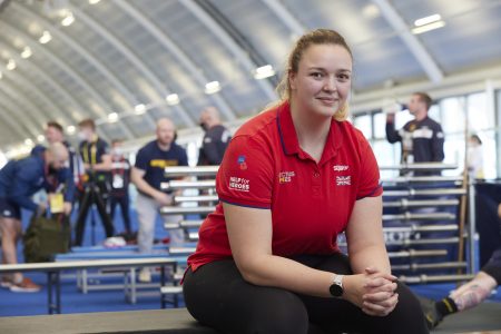 Lucy Holt sat down wearing a red Help for Heroes t-shirt