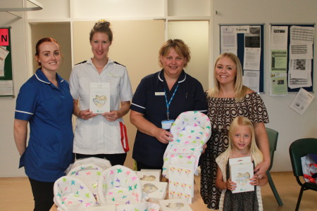 Deputy sister Stacey Raynor, staff nurse Helen Fletcher, ward manager Rachel Wright, staff nurse Jenna Robinson with daughter Ophelia Wilkes