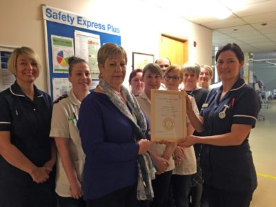 Averil Adams, sister on Clayton ward accepting the carer’s award certificate