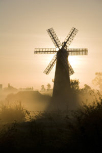 Autumnal sunrise through mists behind Sibsey Trader Mill in Lincolnshire fens.