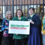 Macmillan Cancer support team with sign