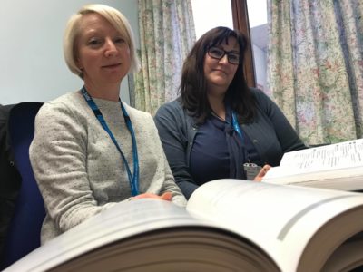 Photograph of Susan and Rebecca with their index books. JPEG