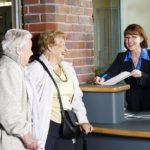 NHS patients booking in at hospital reception