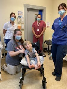 Reuben Bescoby after having his cast removed, with (L to R) Orthopaedic Practitioner, Kim Jenns, his mum Jade Bescoby, Orthopaedic Surgeon, Mohamed Hafez and Orthopaedic Practitioner, Sophie Wilkinson.