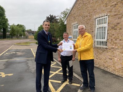 Pictured are (L-R): Director of Finance and Digital and Director of People and OD Paul Matthew, Portering Section Leader Lance Kirk, and Volunteer Andrew LeMerle.