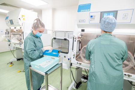 Technicians working in the aseptic unit