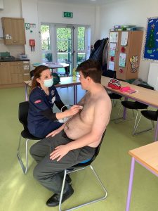 Pictured is Jake with Liz using the replica probe at his school.