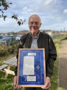 Howard Straughen-Simpson with his gift from colleagues