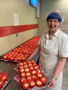 Patricia Hopkins with some of the cupcakes