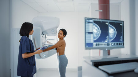 A patient has her breasts screened