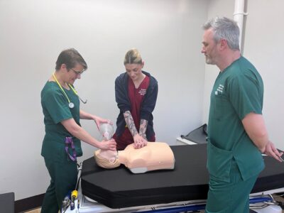 members of the team getting ready for the 12-hour sponsored CPR-a-thon. (L-R) Critical Care Outreach ACP Hayley Head, Clinical Support Worker Kirsten Jackson from the Hospital At Night Team and Critical Care ACP Robert Hefferman.