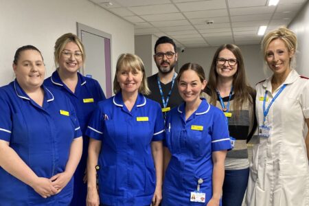 hospital staff proudly wearing their badges