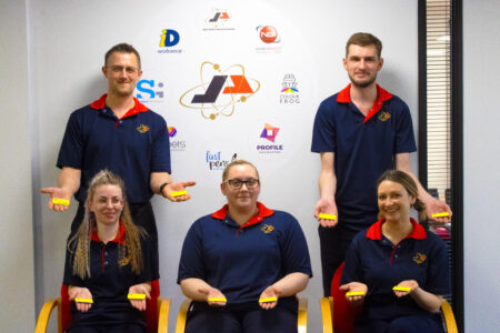 some of the team from Name Badges International with the badges