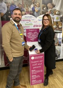 Charity Manager Ben Petts and Dawn Canner, who is a hospital receptionist, with one of the donation points