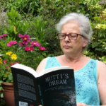 Florence Moore reading one of the books