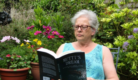 Florence Moore reading one of the books