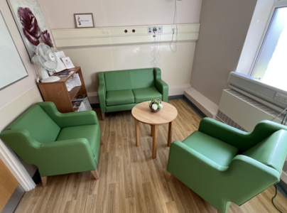emerald suite in Grantham. Room with green sofas and chairs