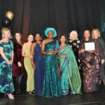 The Black and Asian Maternal Health Group with their award smiling at the camera