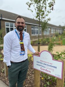 Ben Petts, a man standing in the charity garden