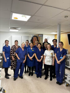 A group of people standing together smiling.