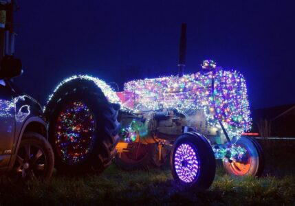 Tractor lit up with Christmas lights