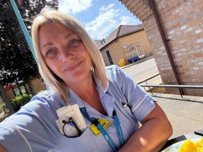 Health Care Worker sat outdoors