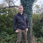 Ross Kaye stood in front of a tree