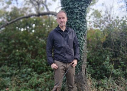 Ross Kaye stood in front of a tree